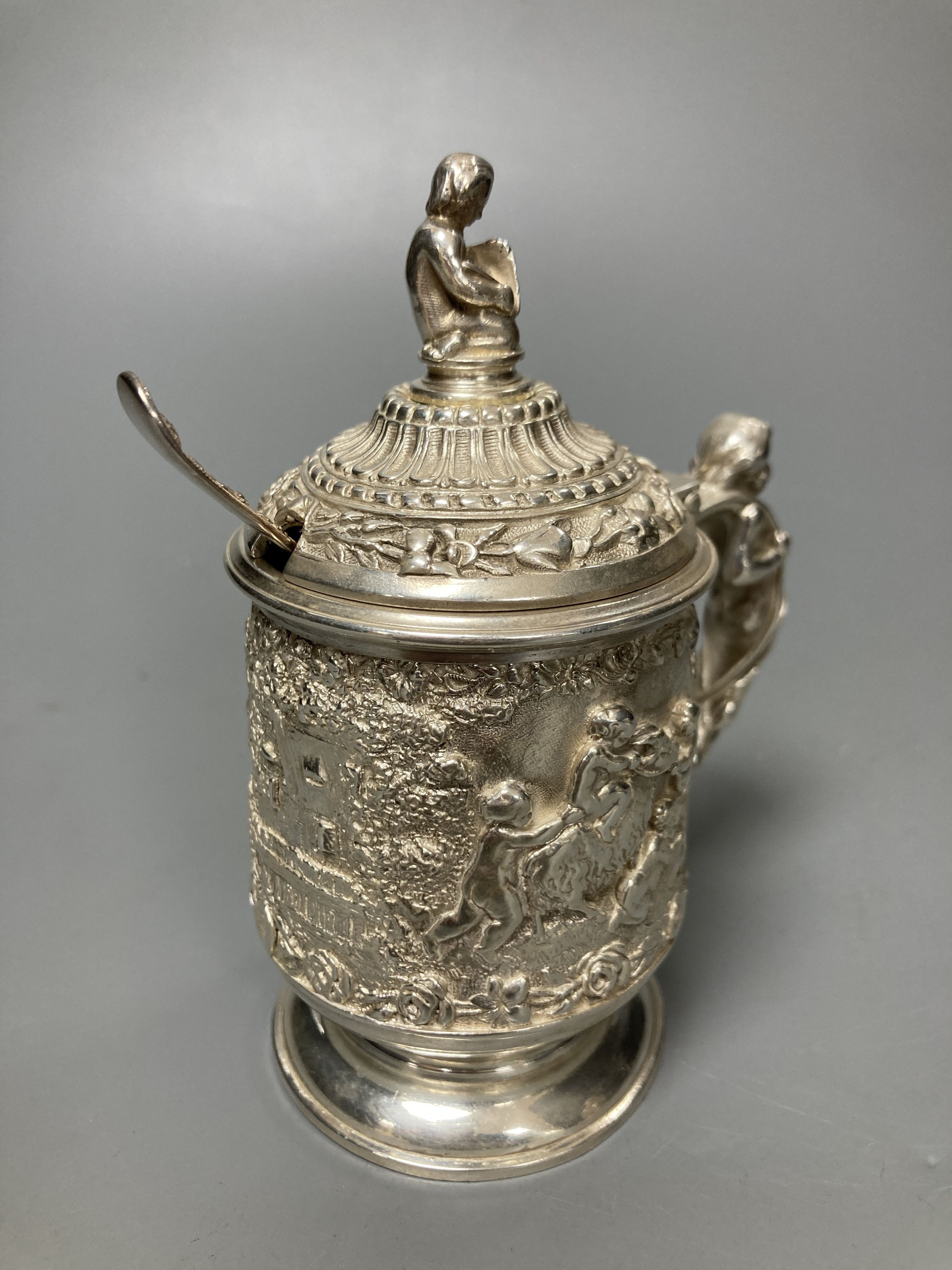 A three piece silver plated cruet set, by Elkington and co-, mustard pot and cover 11.5 cm high